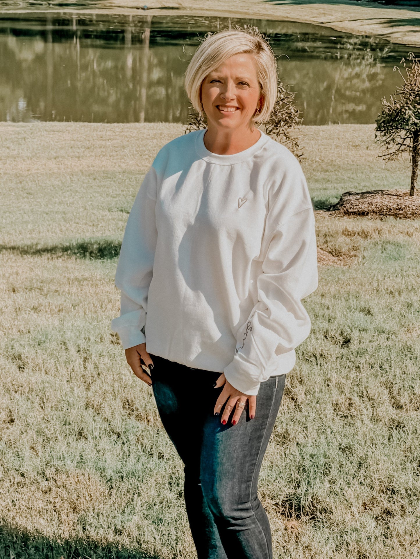 Embroidered She Is Strong Sweatshirt: White